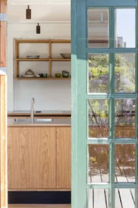 Custom wooden kitchen by Konga Kitchen with tenon joints, combining modern functionality and traditional craftsmanship.