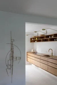 Scandinavian minimalist kitchen with natural wood cabinets and exposed tenon joinery by kongacph