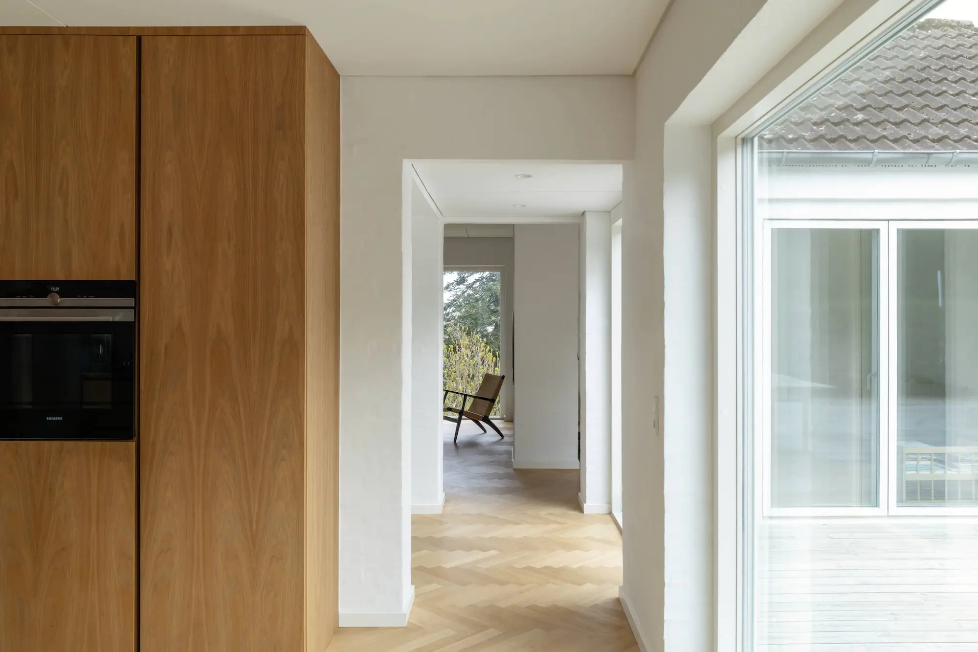 Timeless Wooden Kitchen in Copenhagen 23 tall cabinets design