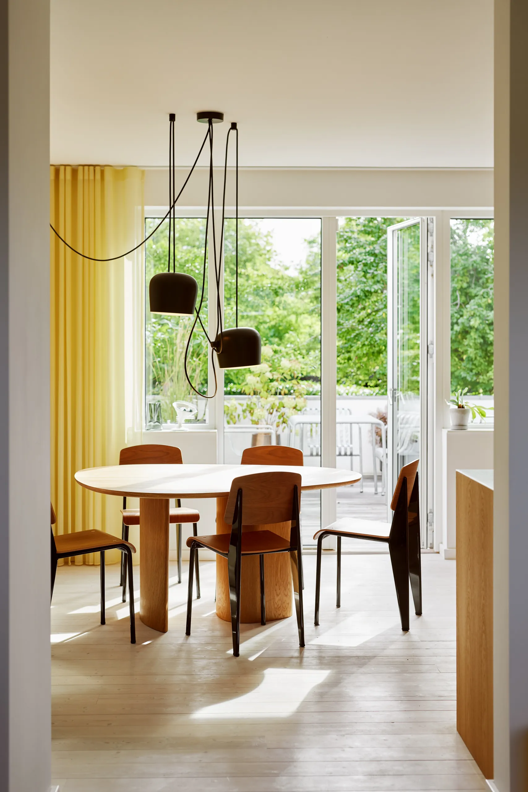 A Calm L-Shaped Oak Kitchen in Anne Boysen’s Home 24 dining table at Anne Boysen